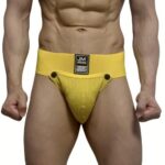 Close-up of a man wearing a bright yellow jockstrap with a wide waistband and a stitched front pouch, brand label visible at the center.