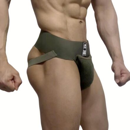 Man wearing a dark-green athletic jockstrap with a wide waistband and side straps, shown from the torso to thighs.