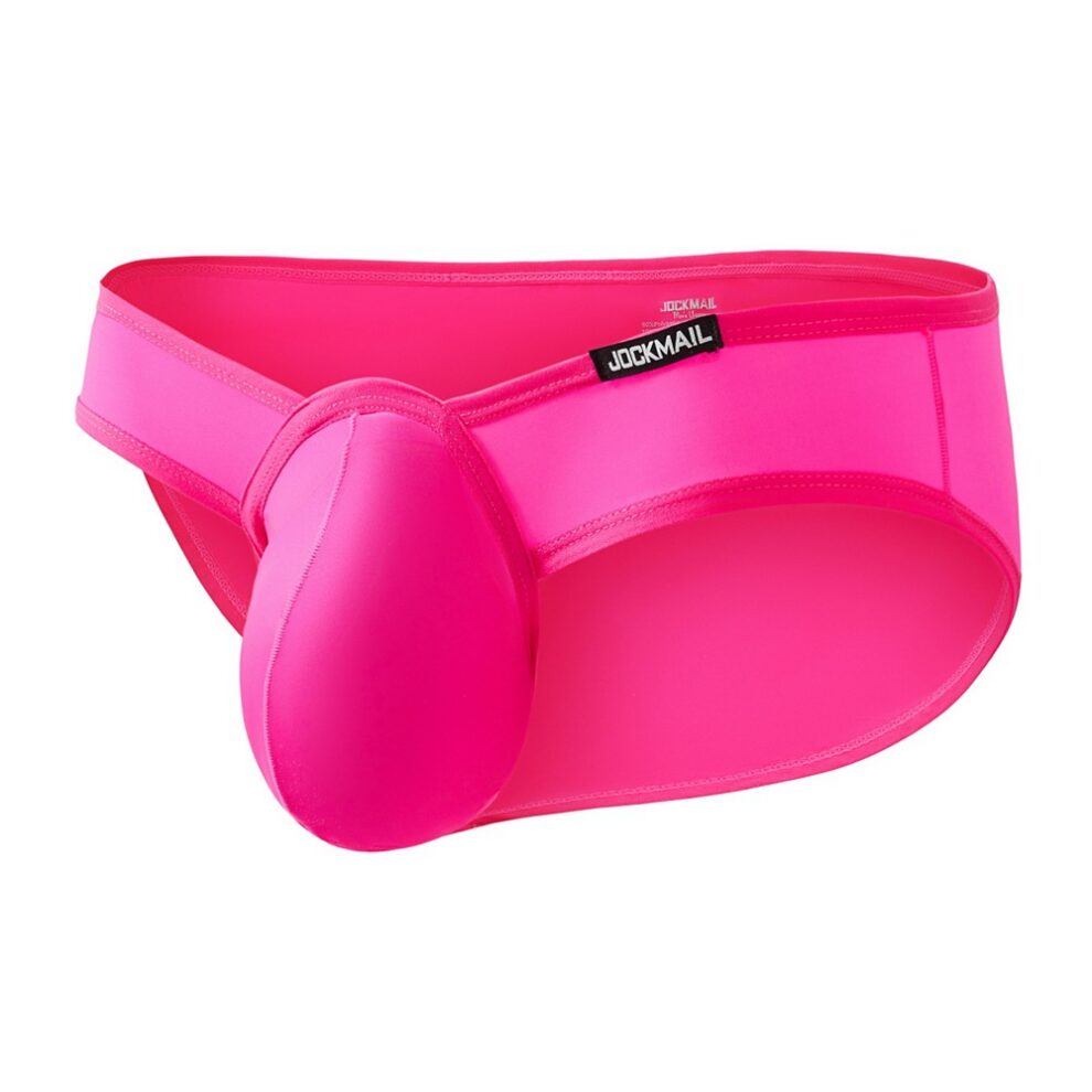 Bright pink men's jockstrap with a contoured pouch and wide waistband, brand label visible.