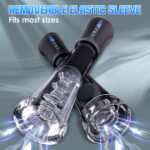 Product image of a removable elastic sleeve for a sex toy, showing two adjustable black sleeves with control panels and transparent ends, cross‑shaped.