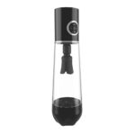 Handheld immersion blender with black motor housing attached to a tall clear blending jar and blade assembly inside.