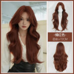 Long orange-red, wavy wig (72 cm) shown on a model and on a mannequin (front and back views).