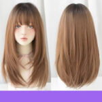Side-by-side views of a light brown, straight wig with bangs on a mannequin: front and back.