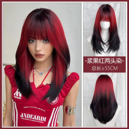 Woman with red and black layered hair, wearing a red top, looking at the camera (collage showcasing a two-tone wig style).