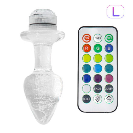 Clear glass, heart-shaped LED lamp with a remote control featuring multiple color buttons for color changing and effects.