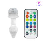 Small crystal-like LED light device beside a multicolor IR remote with color buttons and modes (on/off, timer, fade, jump)